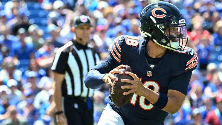 Aug 10, 2024; Orchard Park, New York, USA; Chicago Bears quarterback Caleb Williams (18) runs out of the pocket in the first quarter of a pre-season game against the Buffalo Bills at Highmark Stadium. Mandatory Credit: Mark Konezny-USA TODAY Sports