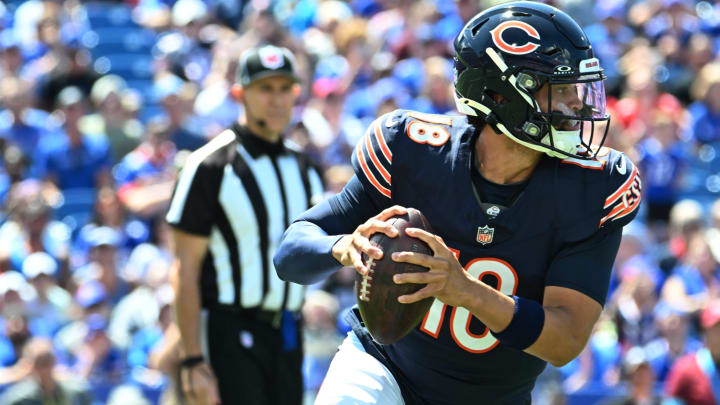 Caleb Williams moves out of the pocket with eyes downfield in his Bears debut.