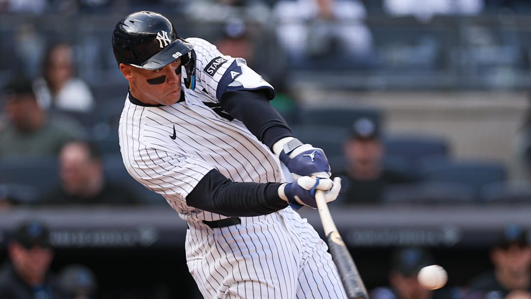 Apr 3, 2026; Bronx, New York, USA; New York Yankees right fielder Aaron Judge (99) singles during the eighth inning against the Miami Marlins at Yankee Stadium. Mandatory Credit: Vincent Carchietta-Imagn Images