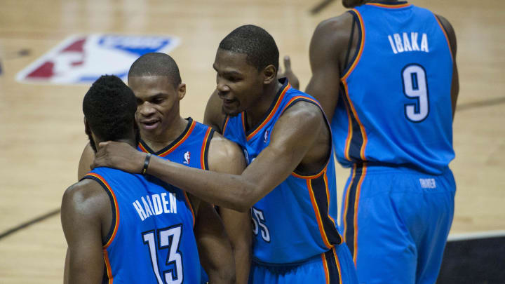 Oklahoma City Thunder forward Kevin Durant (35) and guards Russell Westbrook (center) and James Harden (13) react against the San Antonio Spurs during the second half in game five of the Western Conference finals of the 2012 NBA playoffs.  Mandatory Credit: