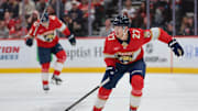 Nov 1, 2025; Sunrise, Florida, USA; Florida Panthers center Eetu Luostarinen (27) moves the puck against the Dallas Stars during the second period at Amerant Bank Arena. Mandatory Credit: Sam Navarro-Imagn Images