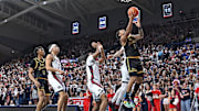 Feb 13, 2025; Spokane, Washington, USA; San Francisco Dons guard Malik Thomas (1) shoots against Gonzaga Bulldogs guard Dusty Stromer (4) in the first half at McCarthey Athletic Center. Mandatory Credit: James Snook-Imagn Images
