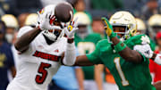 Notre Dame safety Jordan Clark (1) disrupts a catch and tackles Louisville wide receiver Caullin Lacy (5) during a NCAA college football game between Notre Dame and Louisville at Notre Dame Stadium on Saturday, Sept. 28, 2024, in South Bend.