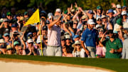 Apr 13, 2024; Augusta, Georgia, USA; Bryson DeChambeau holds up his ball on No. 18 after sinking a