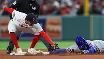 May 20, 2025; Boston, Massachusetts, USA; New York Mets designated hitter Mark Vientos (27) slides past Boston Red Sox second baseman David Hamilton (17) during the fourth inning at Fenway Park. Mandatory Credit: Paul Rutherford-Imagn Images