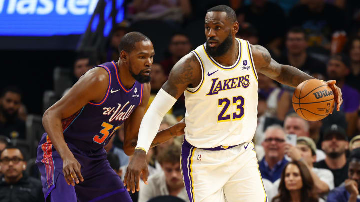 Feb 25, 2024; Phoenix, Arizona, USA; Los Angeles Lakers forward LeBron James (23) against Phoenix Suns forward Kevin Durant (35) at Footprint Center. Mandatory Credit: Mark J. Rebilas-USA TODAY Sports