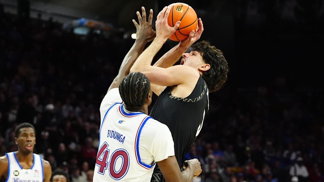 Jan 20, 2026; Boulder, Colorado, USA; Kansas Jayhawks forward Flory Bidunga (40) defends on Colorado Buffaloes forward Alon Michaeli (3) in the second half at the CU Events Center. Mandatory Credit: Ron Chenoy-Imagn Images
