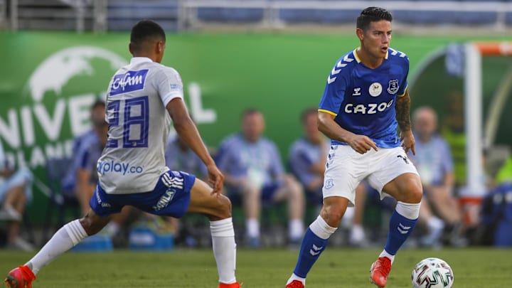 Jul 25, 2021; Orlando, Florida, USA; Everton midfielder James Rodriguez (19) controls the ball while defended by Millonarios defender Stiven Vega (28) during a 2021 Florida Cup championship soccer match at Camping World Stadium. Mandatory Credit: Sam Navarro-Imagn Images