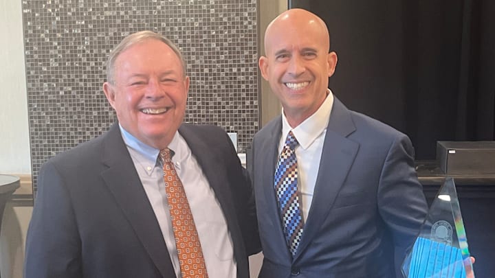 Jack Degele (left) poses with Our Lady of Mount Carmel basketball coach Tony Martin after Martin was selected as the Baltimore Catholic League Coach of the Year at the league’s annual award luncheon in February. Degele has stepped down as the BCL commissioner after a successful 25-year run. Jack Degele (left) poses with Our Lady of Mount Carmel basketball coach Tony Martin after Martin was selected as the Baltimore Catholic League Coach of the Year at the league’s annual award luncheon in February. Degele has stepped down as the BCL commissioner after a successful 25-year run.