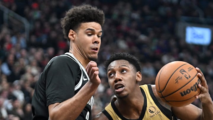 Feb 22, 2024; Toronto, Ontario, CAN;   Toronto Raptors forward RJ Barrett (9) drives to the basket against Brooklyn Nets forward Cam Johnson (2) in the first half at Scotiabank Arena. Mandatory Credit: Dan Hamilton-USA TODAY Sports