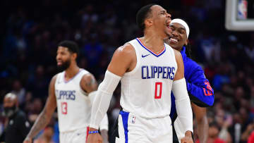 Jan 21, 2024; Los Angeles, California, USA; Los Angeles Clippers guard Russell Westbrook (0) and guard Terance Mann (14) react after forward Kawhi Leonard (2) scores three point basket against the Brooklyn Nets during the second half at Crypto.com Arena. Mandatory Credit: Gary A. Vasquez-USA TODAY Sports