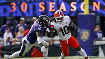 Sep 14, 2025; Baltimore, Maryland, USA; Cleveland Browns running back Quinshon Judkins (10) runs the ball against Baltimore Ravens linebacker Roquan Smith (0) during the fourth quarter at M&T Bank Stadium. Mandatory Credit: Peter Casey-Imagn Images