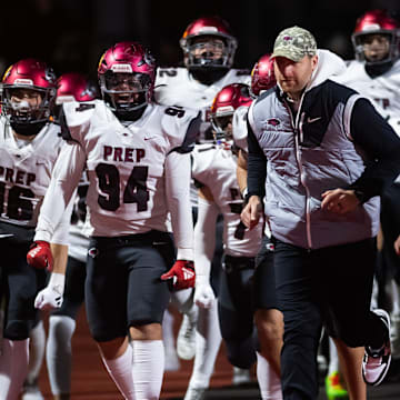 St. Joseph's Prep head coach Tim Roken and the Hawks take the field to play in the PIAA Class 6A football championship game against Central Catholic at Cumberland Valley High School, Saturday, Dec. 7, 2024, in Silver Spring Township, Pa.