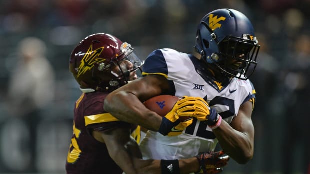 Gary Jennings breaks the tackle of Arizona State Sun Devils DB Kareem Orr. Credit: Joe Camporeale-USA TODAY Sport