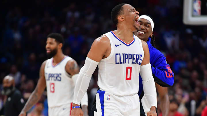 Jan 21, 2024; Los Angeles, California, USA; Los Angeles Clippers guard Russell Westbrook (0) and guard Terance Mann (14) react after forward Kawhi Leonard (2) scores three point basket against the Brooklyn Nets during the second half at Crypto.com Arena. Mandatory Credit: Gary A. Vasquez-USA TODAY Sports