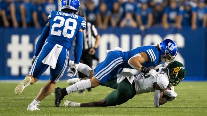 Sep 10, 2022; Provo, Utah, USA; Baylor Bears wide receiver Hal Presley (16) catches a pass against Brigham Young Cougars linebacker Ben Bywater (2) in the first half at LaVell Edwards Stadium.