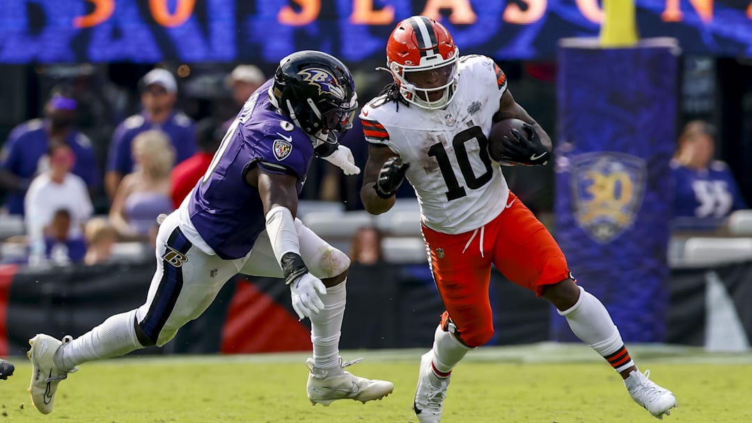 Sep 14, 2025; Baltimore, Maryland, USA; Cleveland Browns running back Quinshon Judkins (10) runs the ball against Baltimore Ravens linebacker Roquan Smith (0) during the fourth quarter at M&T Bank Stadium. Mandatory Credit: Peter Casey-Imagn Images