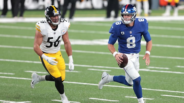 Sep 14, 2020; East Rutherford, New Jersey, USA; New York Giants quarterback Daniel Jones (8) scrambles as Pittsburgh Steelers linebacker Alex Highsmith (56) pursues during the second half at MetLife Stadium. Mandatory Credit: Vincent Carchietta-Imagn Images