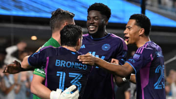 Jul 31, 2024; Charlotte, North Carolina, USA; Charlotte FC goalkeeper David Bingham (22) celebrates with midfielder Brandt Bronico (13) and forward Patrick Agyemang (33) and forward Tyger Smalls (25) after stopping a penalty kick to win the game. Charlotte FC defeated Cruz Azul in a penalty shootout at Bank of America Stadium. Mandatory Credit: Bob Donnan-USA TODAY Sports
