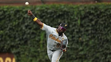 Aug 17, 2025; Chicago, Illinois, USA; Pittsburgh Pirates second baseman Ronny Simon (63) throws the ball towards home plate during eighth inning against the Chicago Cubs at Wrigley Field. Mandatory Credit: Melissa Tamez-Imagn Images