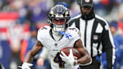 Dec 15, 2024; East Rutherford, New Jersey, USA; Baltimore Ravens wide receiver Zay Flowers (4) carries the ball against the New York Giants during the first quarter at MetLife Stadium. Mandatory Credit: Vincent Carchietta-Imagn Images