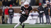 Nov 21, 2024; Atlanta, Georgia, USA; North Carolina State Wolfpack wide receiver Kevin Concepcion (10) runs the ball against the Georgia Tech Yellow Jackets in the first quarter at Bobby Dodd Stadium at Hyundai Field. Mandatory Credit: Brett Davis-Imagn Images