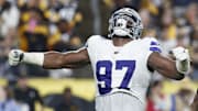 Oct 6, 2024; Pittsburgh, Pennsylvania, USA;  Dallas Cowboys defensive tackle Osa Odighizuwa (97) reacts to sacking Pittsburgh Steelers quarterback Justin Fields (not pictured) during the second quarter at Acrisure Stadium. Mandatory Credit: Charles LeClaire-Imagn Images
