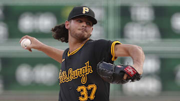 Aug 27, 2024; Pittsburgh, Pennsylvania, USA;  Pittsburgh Pirates starting pitcher Jared Jones (37) delivers a pitch against the Chicago Cubs during the first inning at PNC Park. Mandatory Credit: Charles LeClaire-Imagn Images