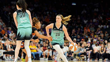 Sep 14, 2025; Phoenix, Arizona, USA; New York Liberty forward Breanna Stewart (30) sets a pick for guard Sabrina Ionescu (20) as she drives past Phoenix Mercury guard Monique Akoa Makani (8) in the second half during game one of the 2025 WNBA Playoffs round one at PHX Arena. Mandatory Credit: Allan Henry-Imagn Images