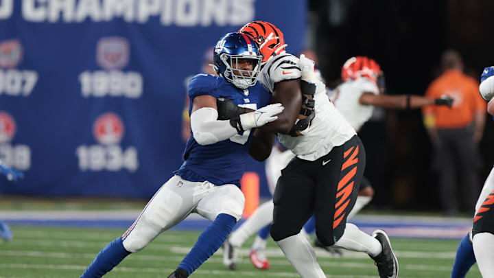 Aug 21, 2022; East Rutherford, New Jersey, USA; New York Giants defensive end Kayvon Thibodeaux (5) rushes  the passer as New York Giants guard Jamil Douglas (77) blocks during the first half at MetLife Stadium. Mandatory Credit: Vincent Carchietta-Imagn Images