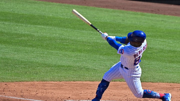 Feb 27, 2023; Mesa, Arizona, USA;  Chicago Cubs right fielder Yonathan Perlaza (87) hits an RBI