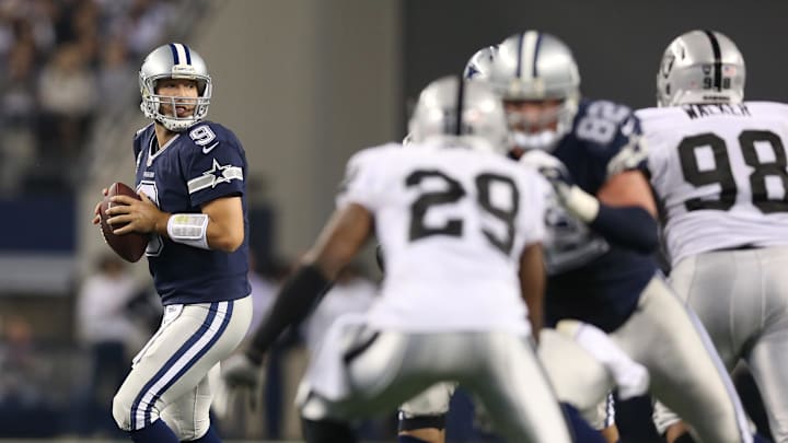 Nov 28, 2013; Arlington, TX, USA; Dallas Cowboys quarterback Tony Romo (9) throws in the pocket against the Oakland Raiders during a NFL football game on Thanksgiving at AT&T Stadium. Mandatory Credit: Matthew Emmons-Imagn Images