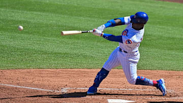 Feb 27, 2023; Mesa, Arizona, USA;  Chicago Cubs right fielder Yonathan Perlaza (87) hits an RBI double in the third inning against the Cleveland Guardians during a spring training game at Sloan Park. Mandatory Credit: Matt Kartozian-Imagn Images