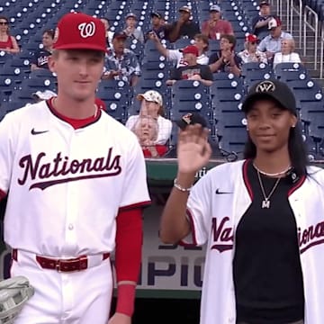 Mo'ne Davis threw out the first pitch to her former LLWS opponent, Robert Hassell III
