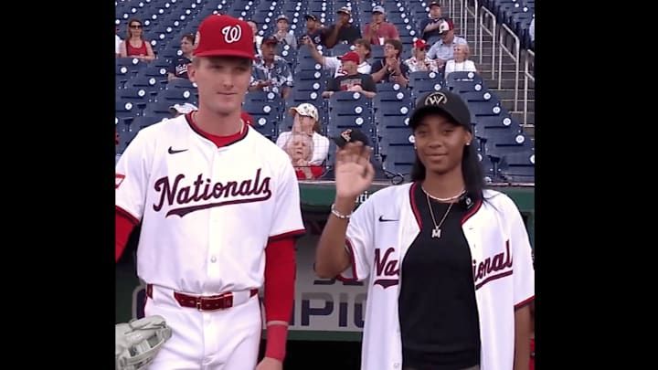 Mo'ne Davis threw out the first pitch to her former LLWS opponent, Robert Hassell III Mo'ne Davis threw out the first pitch to her former LLWS opponent, Robert Hassell III