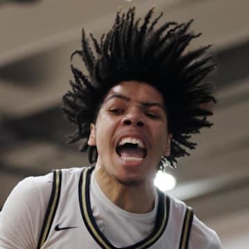 Jan 4, 2025; Gilbert, AZ, USA; Notre Dame High School (CA) forward Tyran Stokes (4) celebrates a slam dunk against Sandra Day O'Connor (AZ) during the Hoophall West High School Invitational at Highland High School. Mandatory Credit: Mark J. Rebilas-Imagn Images