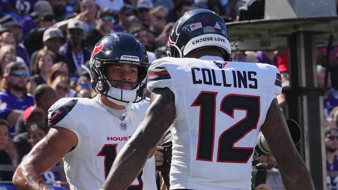 Oct 5, 2025; Baltimore, Maryland, USA; Houston Texans wide receiver Xavier Hutchinson (19) and wide receiver Nico Collins (12) celebrate a touchdown during the first quarter against the Baltimore Ravens at M&T Bank Stadium. Mandatory Credit: Mitch Stringer-Imagn Images