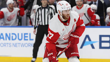 Apr 11, 2025; Tampa, Florida, USA;Detroit Red Wings left wing J.T. Compher (37) plays the puck during overtime against the Tampa Bay Lighting at Amalie Arena. Mandatory Credit: Kim Klement Neitzel-Imagn Images