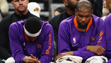 Dec 19, 2024; Phoenix, Arizona, USA; Phoenix Suns guard Bradley Beal (left) and forward Kevin Durant react on the bench against the Indiana Pacers at Footprint Center. Mandatory Credit: Mark J. Rebilas-Imagn Images