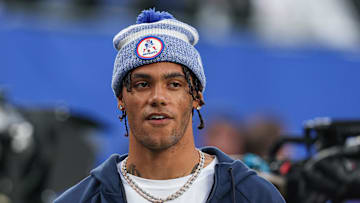 Aug 21, 2025; East Rutherford, New Jersey, USA; New England Patriots cornerback Christian Gonzalez (0) on the field before the preseason game against the New York Giants at MetLife Stadium. Mandatory Credit: Vincent Carchietta-Imagn Images