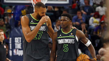 Apr 10, 2025; Memphis, Tennessee, USA; Minnesota Timberwolves center Rudy Gobert (27) talks with guard Anthony Edwards (5) during a time out during the fourth quarter against the Memphis Grizzlies at FedExForum. Mandatory Credit: Petre Thomas-Imagn Images