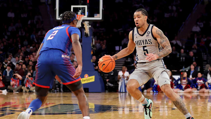 Mar 12, 2025; New York, NY, USA; Georgetown Hoyas guard Micah Peavy (5) controls the ball against DePaul Blue Demons guard Layden Blocker (2) during the second half at Madison Square Garden. Mandatory Credit: Brad Penner-Imagn Images