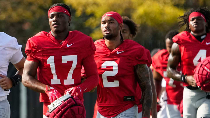 Aug 1, 2024; Columbus, OH, USA; Ohio State Buckeyes wide receivers Carnell Tate (17) and Emeka Egbuka (2) run between drills during football camp at the Woody Hayes Athletic Complex.