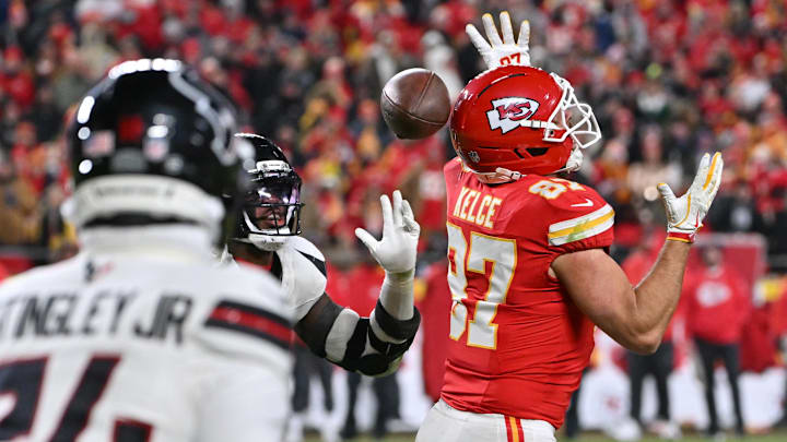 Dec 7, 2025; Kansas City, Missouri, USA; Kansas City Chiefs tight end Travis Kelce (87) fails to haul in a pass that Houston Texans linebacker Azeez Al-Shaair (0) would intercept during the fourth quarter at GEHA Field at Arrowhead Stadium. Mandatory Credit: Amy Kontras-Imagn Images