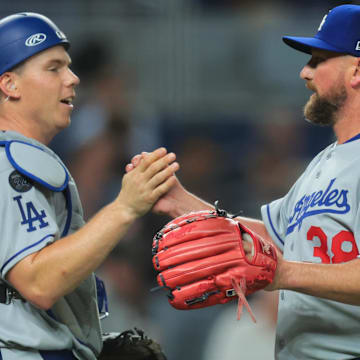 May 5, 2025; Miami, Florida, USA; Los Angeles Dodgers relief pitcher Kirby Yates (38) celebrates with catcher Will Smith (16) after the game against the Miami Marlins at loanDepot Park. Mandatory Credit: Sam Navarro-Imagn Images