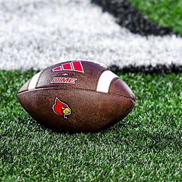 A football lies on the turf of L&N Stadium during Louisville's spring game.