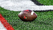 A football lies on the turf of L&N Stadium during Louisville's spring game.