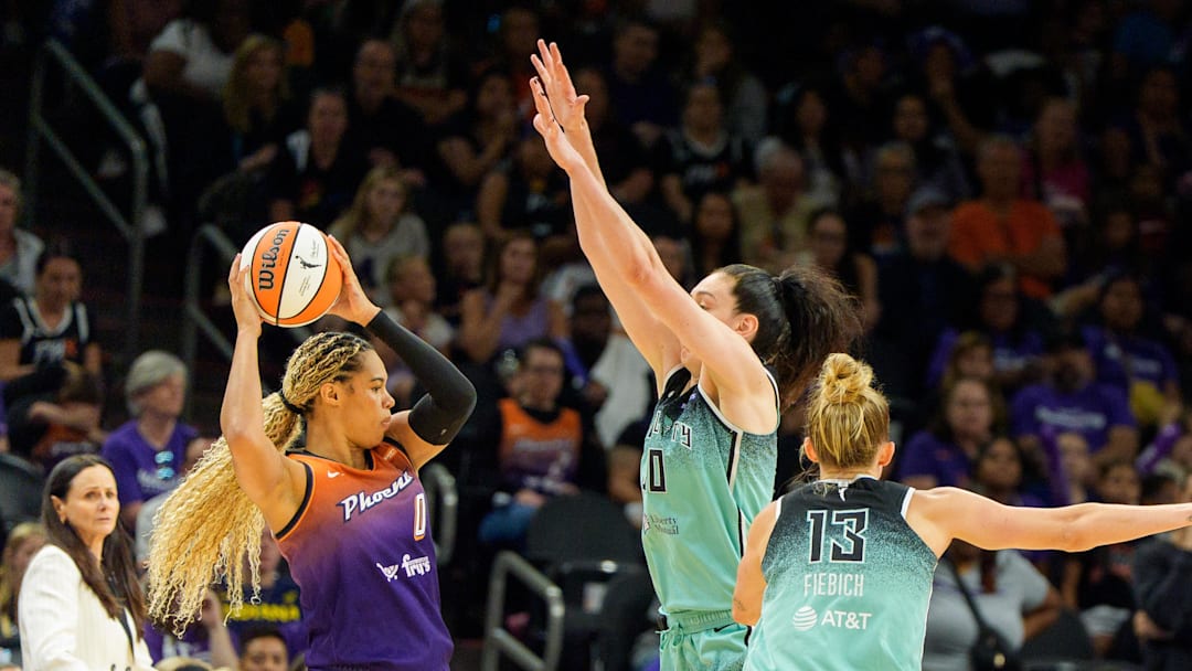 Sep 14, 2025; Phoenix, Arizona, USA; New York Liberty forward Breanna Stewart (30) and forward Leonie Fiebich (13) double team Phoenix Mercury forward Satou Sabally (0) in overtime during game one of the 2025 WNBA Playoffs round one at PHX Arena. Mandatory Credit: Allan Henry-Imagn Images