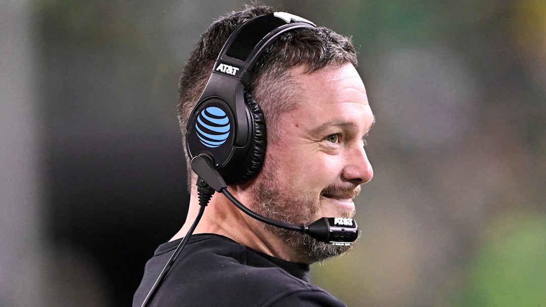 Dec 20, 2025; Eugene, OR, USA;  Oregon Ducks head coach Dan Lanning smiles during the third quarter against the James Madison Dukes at Autzen Stadium. Mandatory Credit: Craig Strobeck-Imagn Images