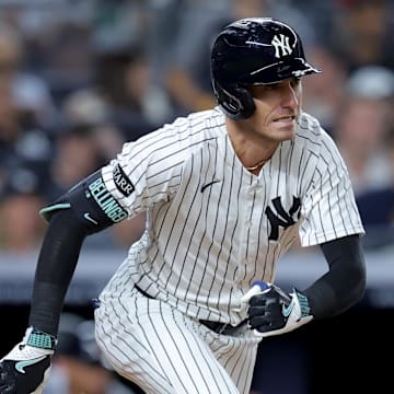 Sep 11, 2025; Bronx, New York, USA; New York Yankees center fielder Cody Bellinger (35) follows through on an RBI single against the Detroit Tigers during the fourth inning at Yankee Stadium. Mandatory Credit: Brad Penner-Imagn Images
